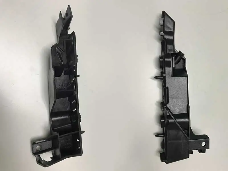 Automotive components - left and right upper brackets are produced by EM320-SVP/2 Injection Molding Machine